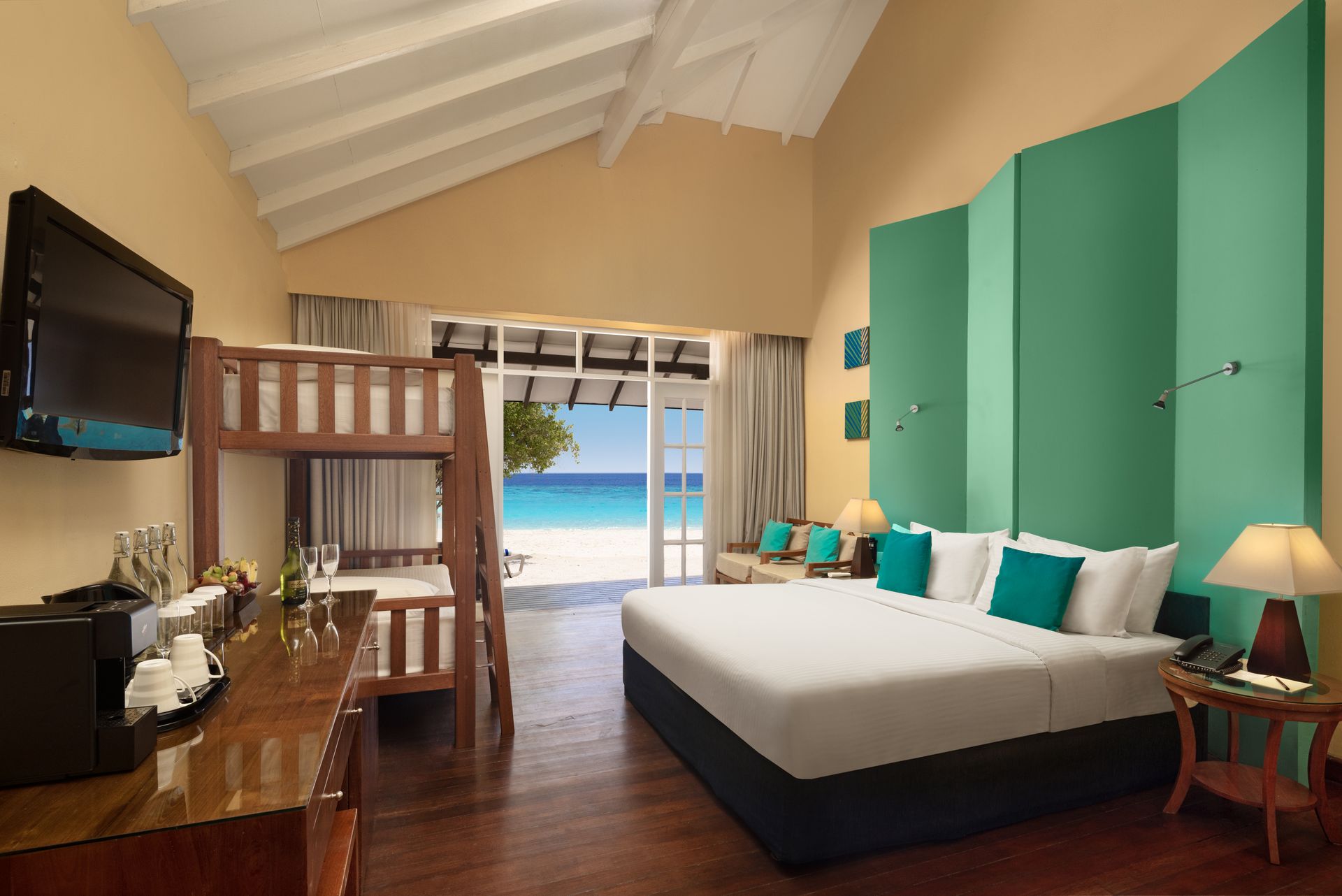 Family Beach Villa_king size bed_Adaaran Select Meedhupparu_Conch Holidays