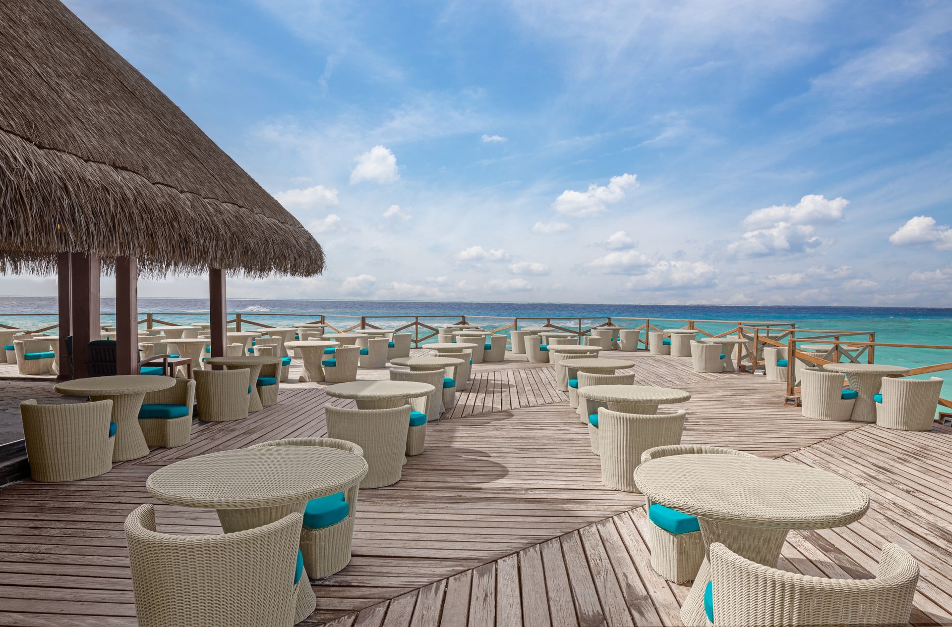 https://conchholidays.com/wp-content/uploads/2026/05/Main-Bar_overwater-deck_Adaaran-Club-Rannalhi_Conch-Holidays.jpg