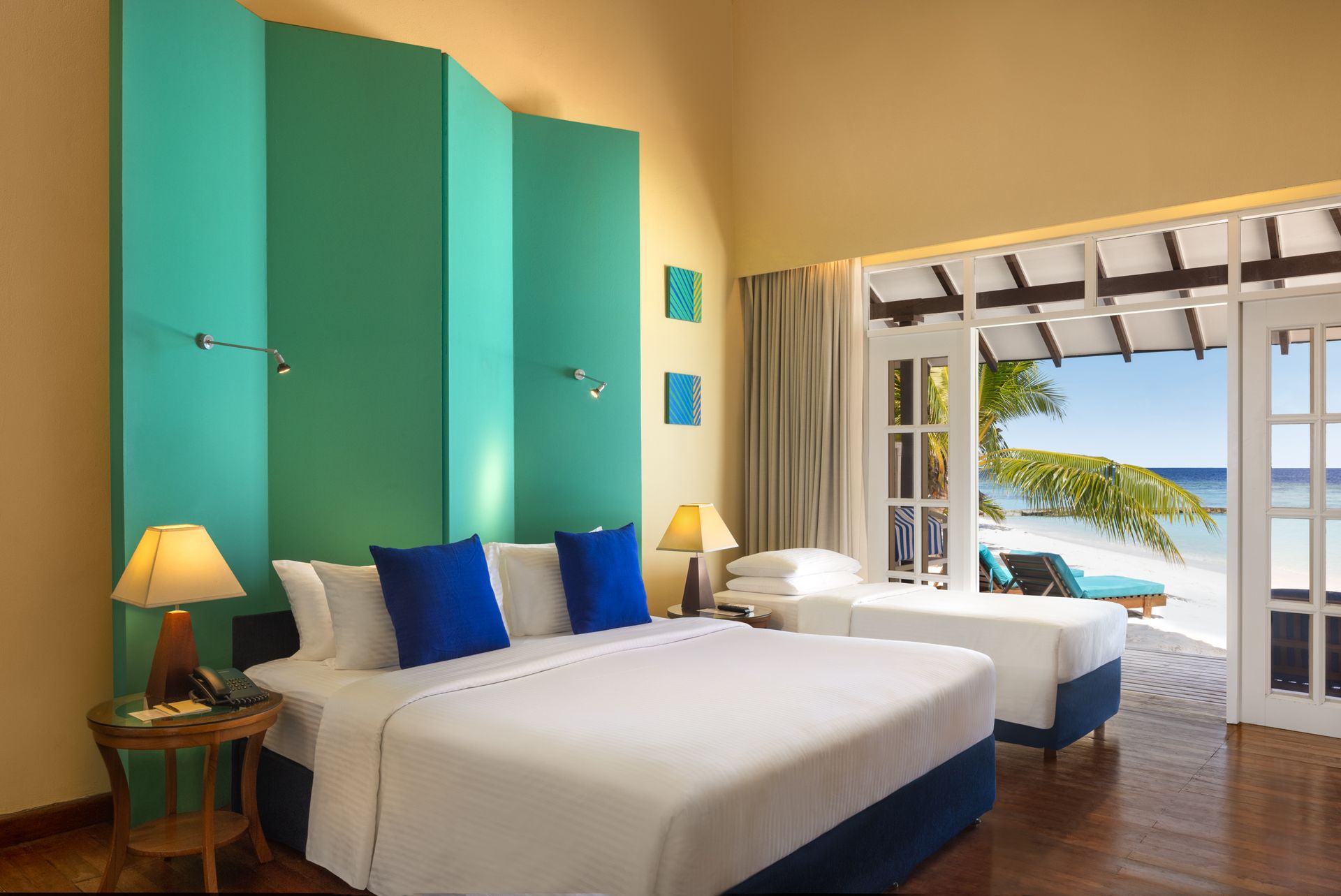 beach-villa-interior-extra-bed-Adaaran Select Meedhupparu_Conch Holidays