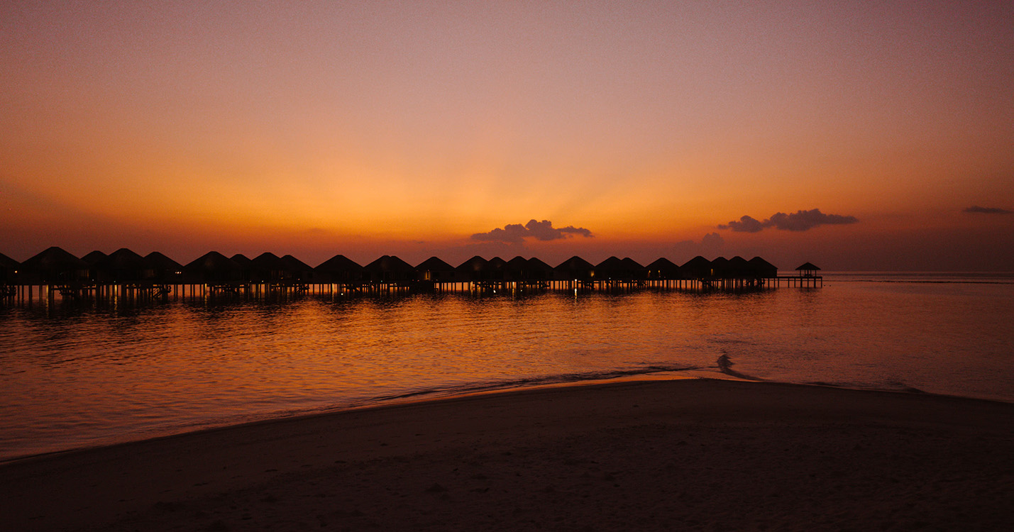 overwater villa jetty - sunset_Adaaran Prestige Vadoo_Aerial_Conch